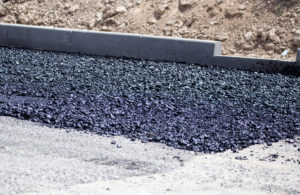 close up photo of freshly laid black pavement