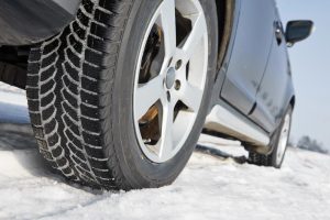 Ohio Salt Brine image shows vehicle driving over snowy road