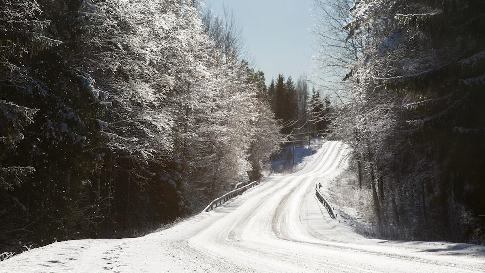 liquid calcium chloride and salt brine can be used during road salt shortage image shows snowy rural road