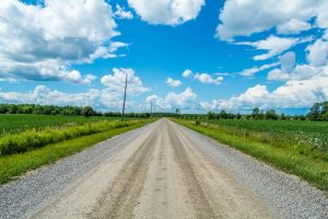 Receive help at Indiana Gravel Road Maintenance from Great Lakes Chloride image shows gravel rural road