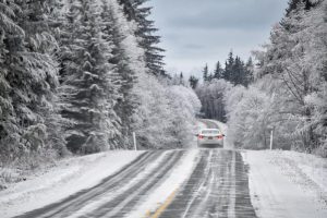 Calcium chloride from Great Lakes Chloride can be an effective Michigan Road Salt Alternative image shows car driving on winter road