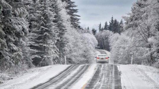 Calcium chloride from Great Lakes Chloride can be an effective Michigan Road Salt Alternative image shows car driving on winter road