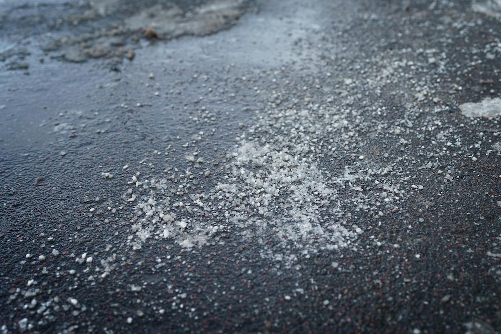 Utilize calcium chloride as an Ohio Road Salt Alternative image shows salt on icy ground