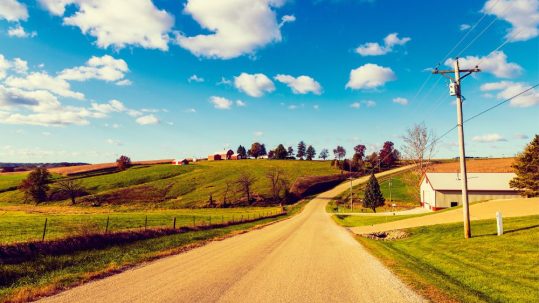Use calcium chloride from Great Lakes Chloride for Indiana Road Base Stabilization image shows gravel road in rural area