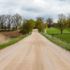 use calcium chloride to improve Michigan Road Base Stabilization image shows gravel road in countryside